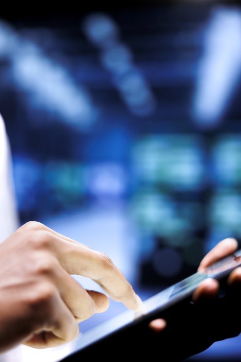 Engineer doing server maintenance plan Adept engineer writing data center disaster contingency plan on tablet to provide rapid restoration of service, limit disruption and minimize interruptions to normal operations